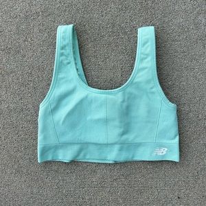 Women’s light teal blue New Balance sports bra with original padding